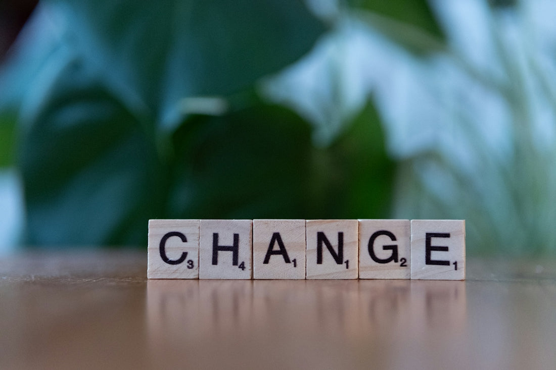 A scrabble block spelling change on a table